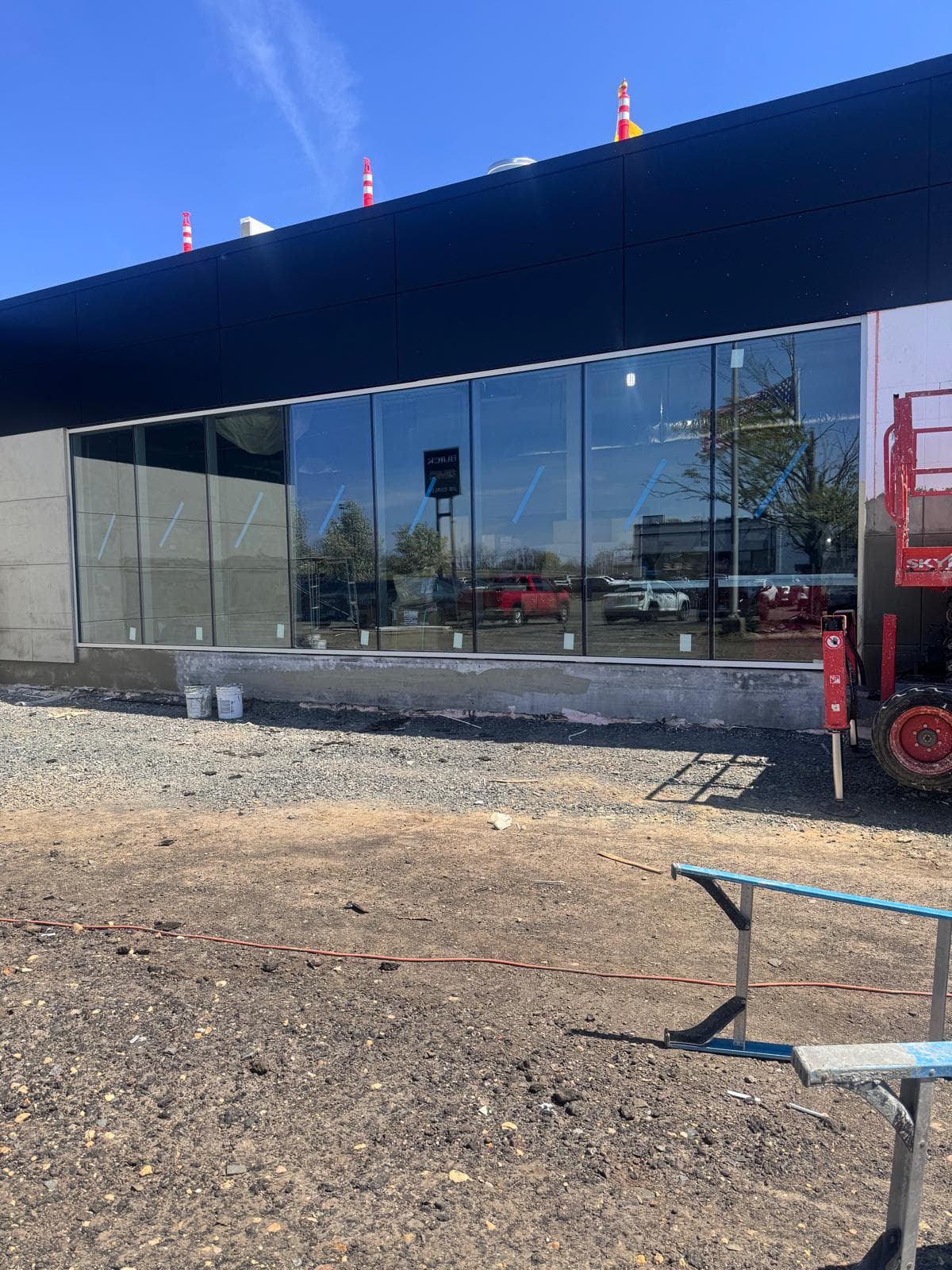 Installed floor-to-ceiling curtain wall glass at Kia in Keyport.