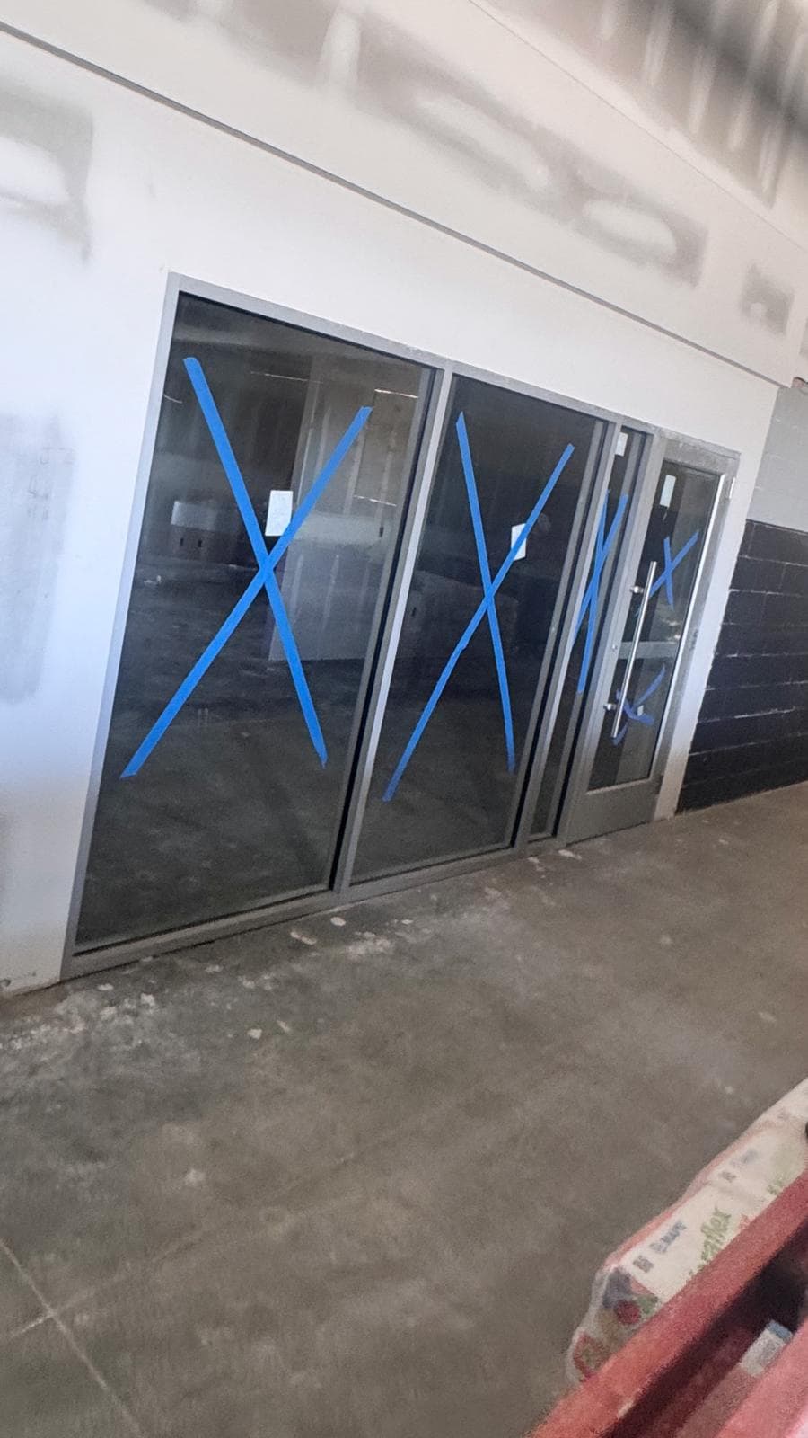 Interior glass partition and door system at the Kia project in Keyport.