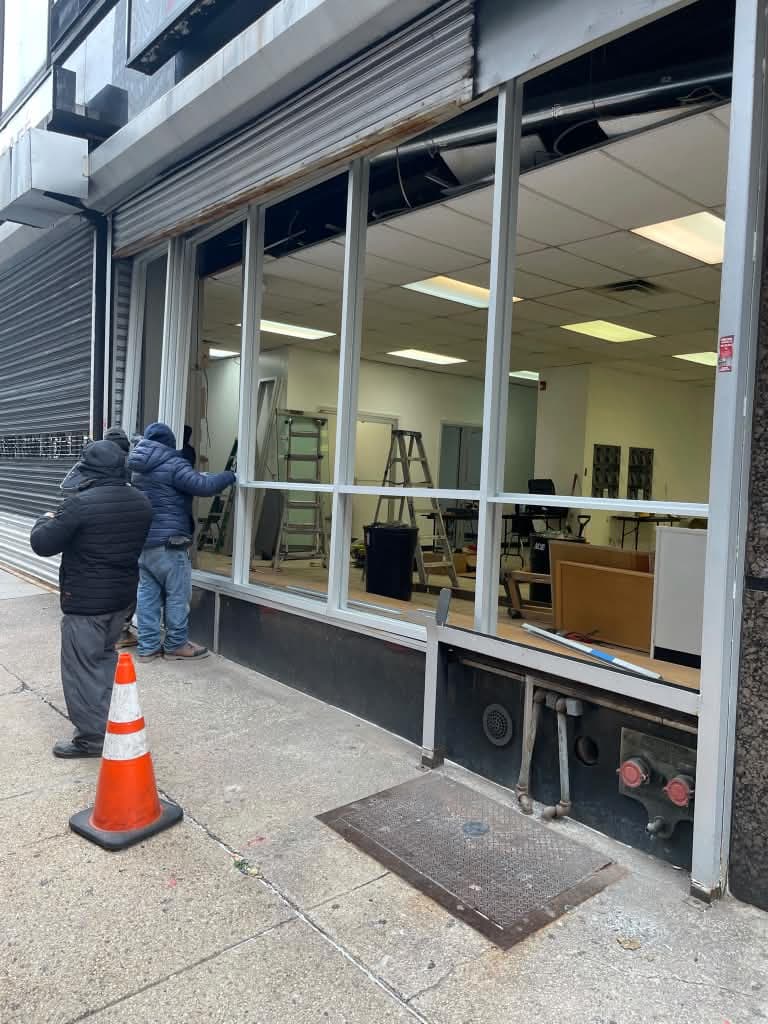 Silver aluminum storefront window framing at Newark Legal Services in Newark, New Jersey.