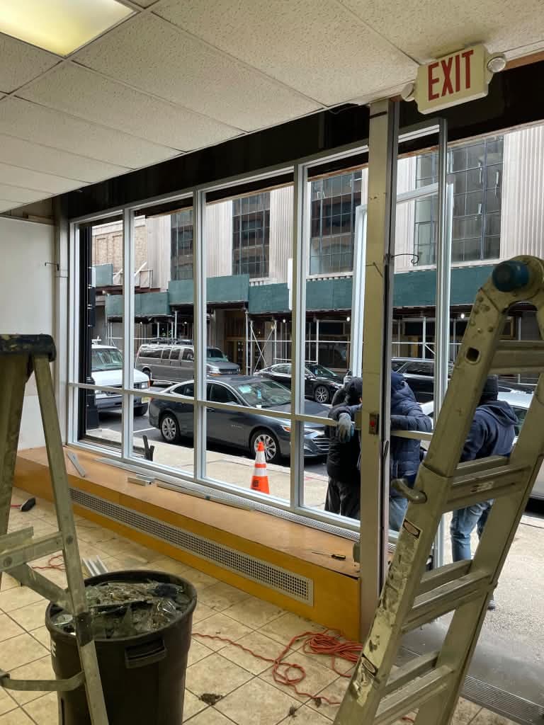 Interior view of the commercial window system during installation in Newark.